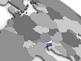 Slovenia on globe with flag