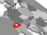 Switzerland on globe with flag