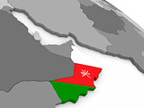 Oman on globe with flag