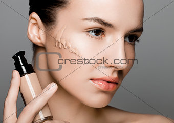 Beauty fashion model woman holding foundation tube