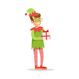 Boy in Glasses With Present Dressed As Santa Claus Christmas Elf For The Costume Holiday Carnival Party