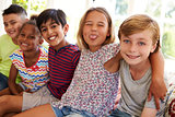 Group Of Multi-Cultural Children On Window Seat Together