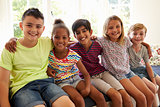 Group Of Multi-Cultural Children On Window Seat Together