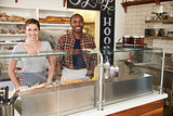 Mixed race couple waiting behind counter at a sandwich bar