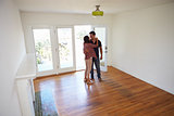 Romantic Couple In New Home On Moving Day