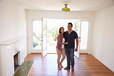 Excited Couple Explore New Home On Moving Day