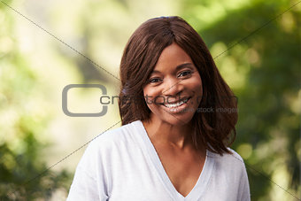 Outdoor Head And Shoulders Portrait Of Woman