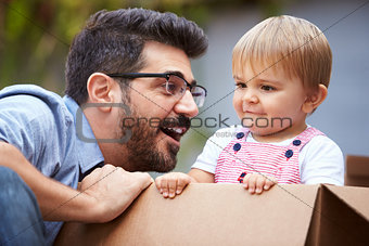 Father Playing With Son In Cardboard Box