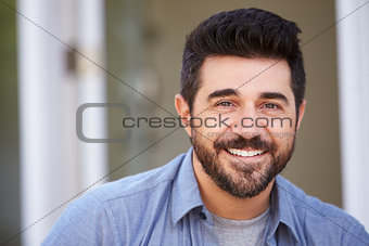 Outdoor Head And Shoulders Portrait Of Smiling Mature Man