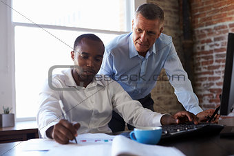 Businessmen Working On Computer In Office