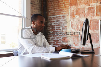 Businessman Working On Computer In Office