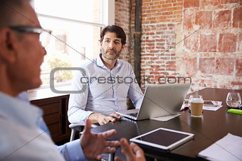 Businessmen Having Creative Brainstorming Meeting In Office