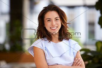 Close up of young mixed race businesswoman looking at camera