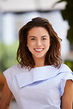 Portrait of smiling young mixed race businesswoman, vertical