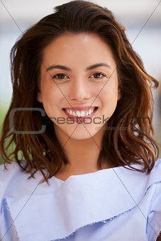 Smiling mixed race young businesswoman, vertical, close up