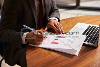 Businessman preparing a document, mid section, close up