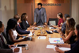 Businessman addressing colleagues at a boardroom meeting