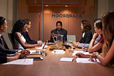 Corporate business people at an evening boardroom meeting
