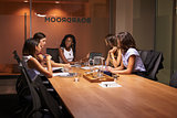 Businesswomen in discussion at an evening meeting