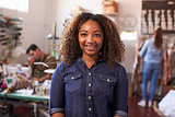 Mixed race female business owner in clothing design studio
