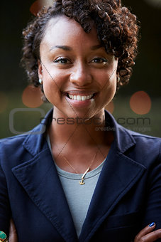 Outdoors Head And Shoulders Portrait Of Smiling Young Woman