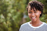 Smiling young African American woman, head and shoulders