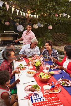 Multi generation black family at 4th July barbecue, vertical