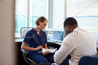 Doctor In Consultation With Depressed Male Patient