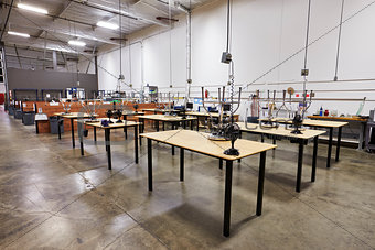 Interior Of Factory With Empty Work Benches