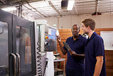 Engineer Training Male Apprentice On CNC Machine