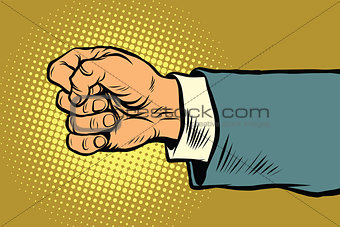 Hand of a businessman beats fist