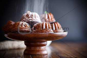 sweet honey muffins in powdered sugar