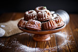 sweet honey muffins in powdered sugar