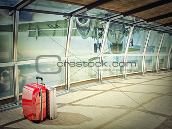 stack of traveling luggage in airport terminal