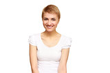 portrait of a casual pretty young smiling girl thinking about something isolated on the white background