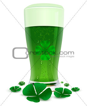 Green drink ale in high transparent glass. Green leaf quatrefoil clover symbol of St. Patricks Day