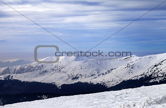 Winter mountains and cloudy sky