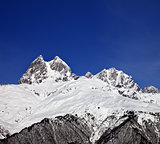Mount Ushba in winter at sun day