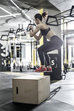 Jumping active woman in gym