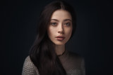 portrait of young elegant woman in knitted sweater