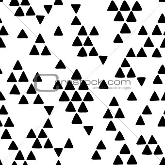Seamless hand drawn geometric tribal pattern with triangles. Vector navajo design.