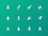 Rocket icons on green background.
