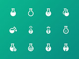 Flacon and flask icons on green background.