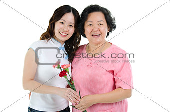 Mother and daughter with carnation flower