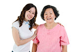 Asian senior mother and adult daughter smiling