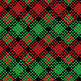 Seamless knitted pattern in black, green and red colors