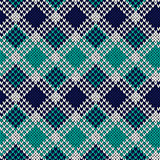 Seamless knitted pattern in blue, turquoise and white colors