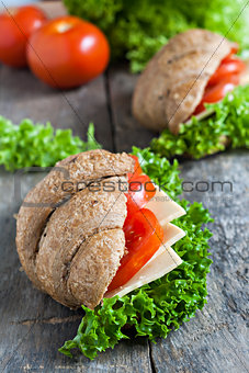 grain vegetarian croissant sandwich on a wooden background old