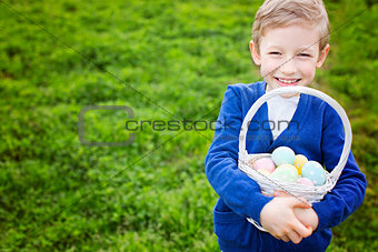 smiling boy with easter eggs
