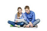 Teen age boy and girl with tablet